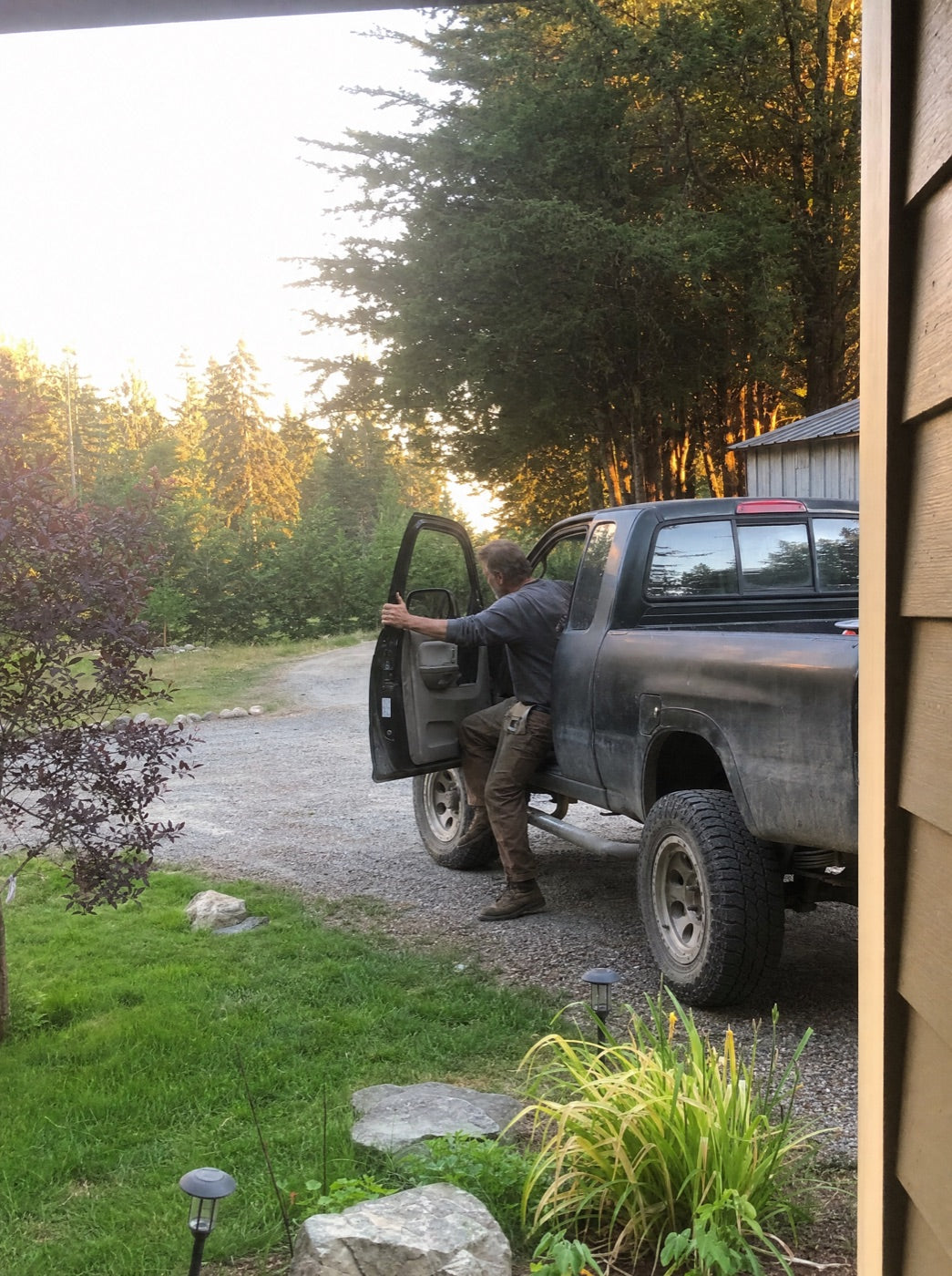 Coming down out of the truck, hanging onto the door