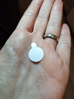 Customer photo: a single Zero-Fit patch on a palm