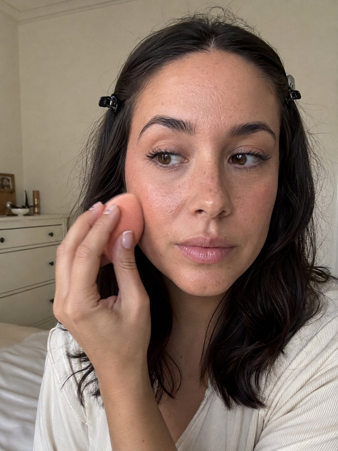 Applying makeup over skin wearing a Zero-Fit patch